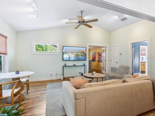 1732 6th St, Sarasota, FL 34236 - living room with light wood-style floors, ceiling fan, rail lighting, and high vaulted ceiling