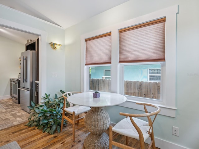 1732 6th St, Sarasota, FL 34236 - dining space featuring lofted ceiling and baseboards