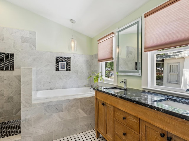 1732 6th St, Sarasota, FL 34236 - bathroom with double vanity, lofted ceiling, a garden tub, and tile patterned flooring