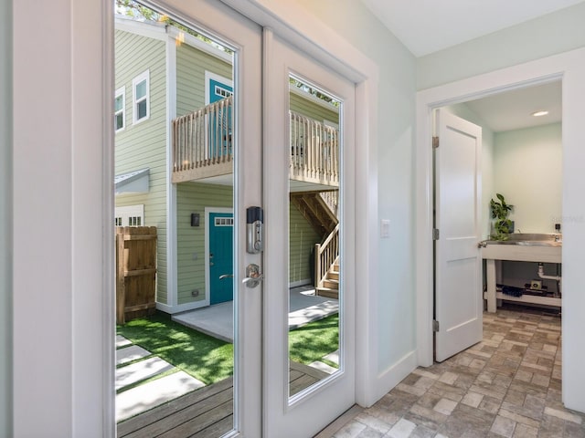 1732 6th St, Sarasota, FL 34236 - entryway featuring baseboards and brick patterned floors