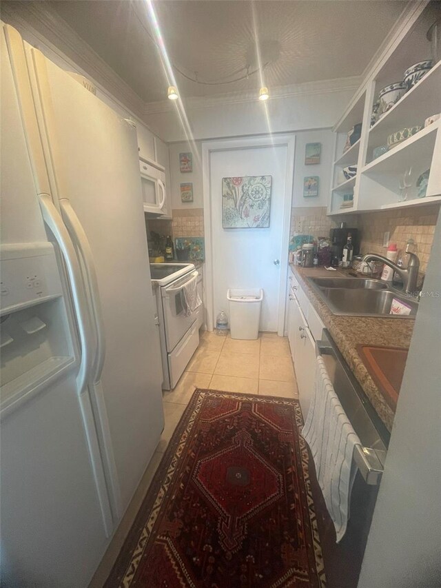 3806 Gulf Of Mexico Dr Unit C205, Longboat Key, FL 34228 - kitchen with white appliances, backsplash, white cabinets, light tile patterned floors, and open shelves