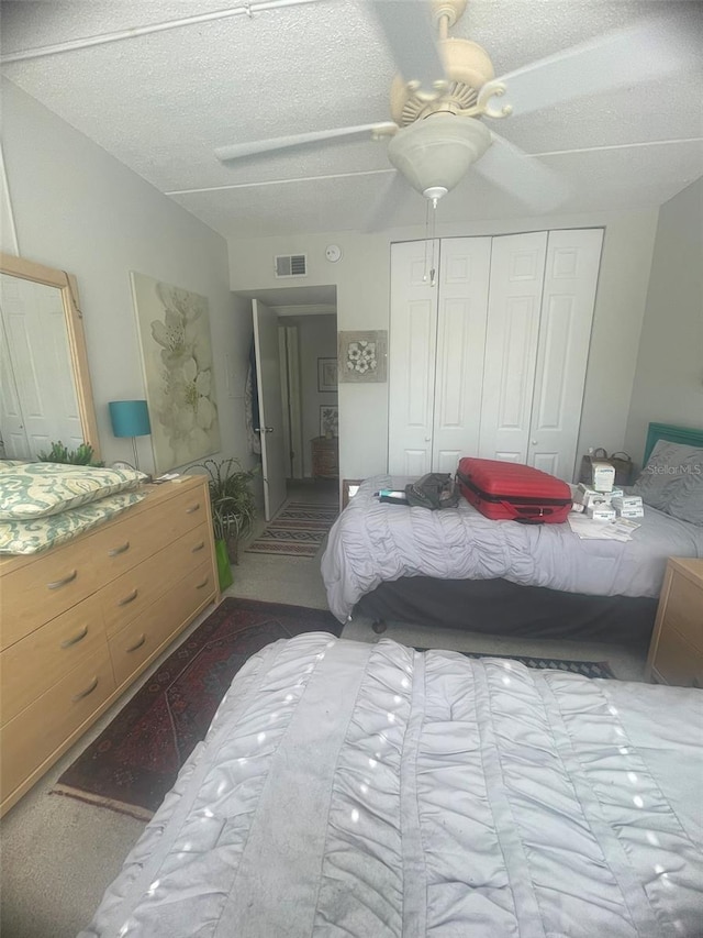 3806 Gulf Of Mexico Dr Unit C205, Longboat Key, FL 34228 - bedroom featuring a closet, a textured ceiling, and a ceiling fan