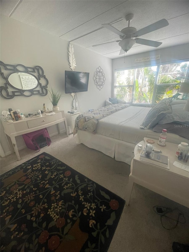 3806 Gulf Of Mexico Dr Unit C205, Longboat Key, FL 34228 - bedroom with carpet flooring, ceiling fan, and a textured ceiling