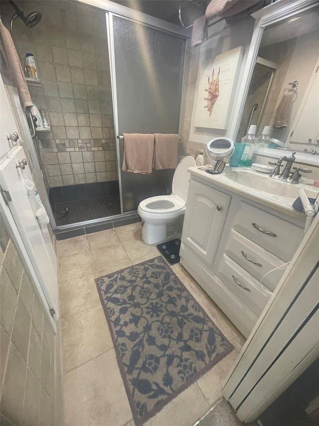 3806 Gulf Of Mexico Dr Unit C205, Longboat Key, FL 34228 - bathroom with vanity, a shower stall, and tile patterned floors