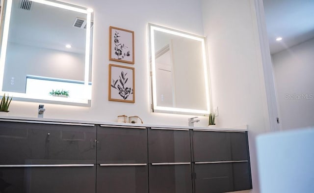 2124 Clematis Pl, Sarasota, FL 34239 - full bathroom with double vanity and recessed lighting