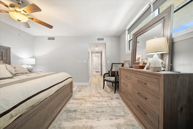 8750 Midnight Pass Rd Unit 501, Sarasota, FL 34242 - bedroom featuring light wood-type flooring, multiple windows, and ceiling fan