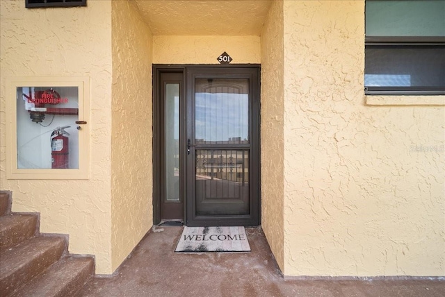 8750 Midnight Pass Rd Unit 501, Sarasota, FL 34242 - doorway to property featuring stucco siding