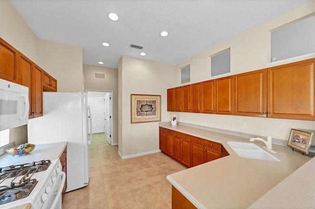 5179 Cantabria Crst, Sarasota, FL 34238 - kitchen featuring white appliances, light countertops, light tile patterned flooring, recessed lighting, and brown cabinetry