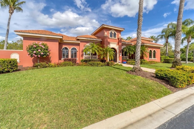 5179 Cantabria Crst, Sarasota, FL 34238 - mediterranean / spanish home with a front lawn, stucco siding, and a tile roof