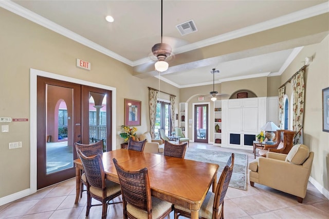 5179 Cantabria Crst, Sarasota, FL 34238 - dining space with ornamental molding, ceiling fan, light tile patterned floors, french doors, and arched walkways