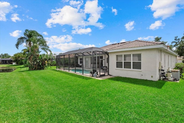 11508 30th Cv E, Parrish, FL 34219 - back of house featuring stucco siding, a lawn, an outdoor pool, a tile roof, and glass enclosure