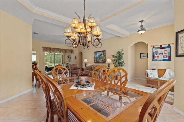 11508 30th Cv E, Parrish, FL 34219 - dining space with arched walkways, light tile patterned floors, crown molding, and a chandelier