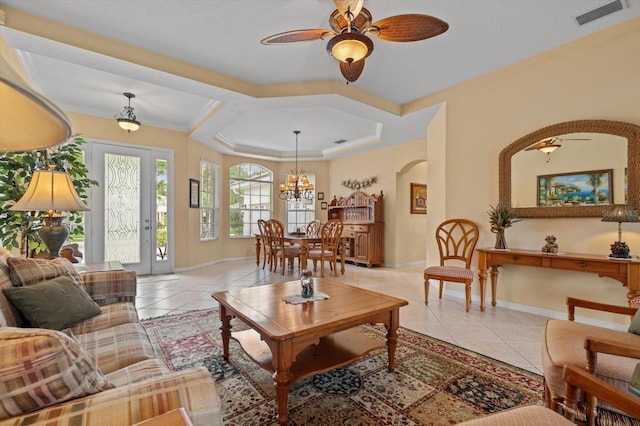 11508 30th Cv E, Parrish, FL 34219 - living room with arched walkways, light tile patterned flooring, a ceiling fan, and a chandelier