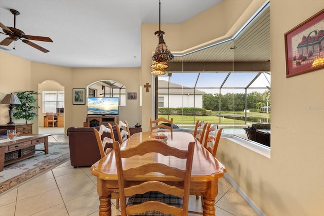 11508 30th Cv E, Parrish, FL 34219 - dining area featuring ceiling fan, light tile patterned floors, and arched walkways