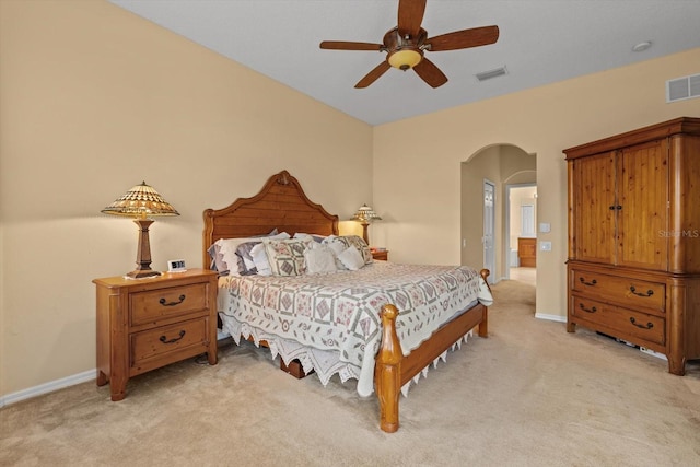 11508 30th Cv E, Parrish, FL 34219 - bedroom with arched walkways, light carpet, and a ceiling fan