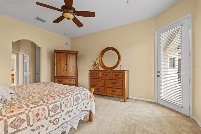 11508 30th Cv E, Parrish, FL 34219 - bedroom with access to outside, carpet, arched walkways, and a ceiling fan