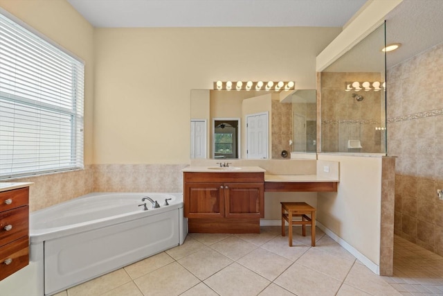 11508 30th Cv E, Parrish, FL 34219 - full bath featuring tile patterned flooring, a bath, vanity, and plenty of natural light