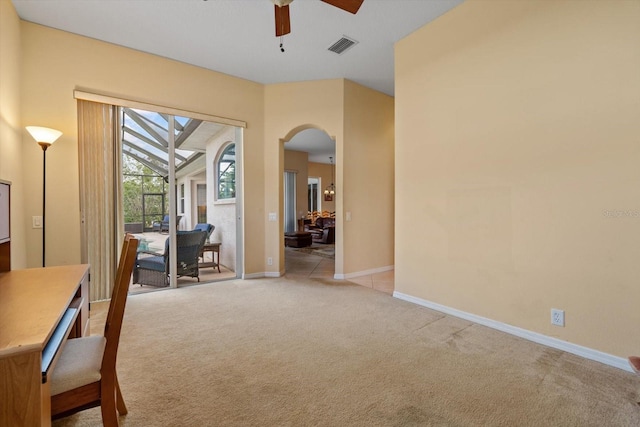 11508 30th Cv E, Parrish, FL 34219 - interior space with a ceiling fan, arched walkways, and light colored carpet