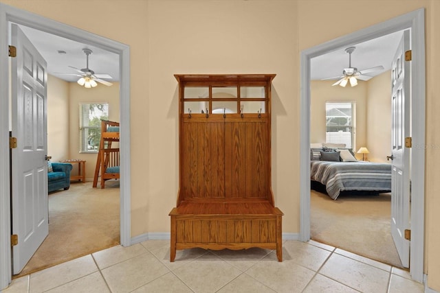 11508 30th Cv E, Parrish, FL 34219 - mudroom with light carpet, ceiling fan, and plenty of natural light