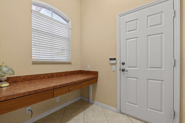 11508 30th Cv E, Parrish, FL 34219 - foyer with light tile patterned floors and baseboards