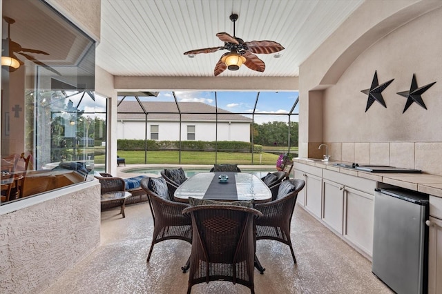 11508 30th Cv E, Parrish, FL 34219 - view of patio / terrace featuring area for grilling, ceiling fan, an outdoor pool, glass enclosure, and outdoor dining space