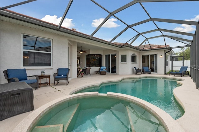 11508 30th Cv E, Parrish, FL 34219 - view of pool featuring a pool with connected hot tub, a patio area, ceiling fan, and glass enclosure
