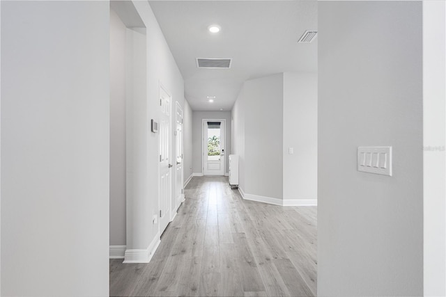 8706 Arrow Creek Dr, Parrish, FL 34219 - hall with light wood-style floors, recessed lighting, and radiator heating unit