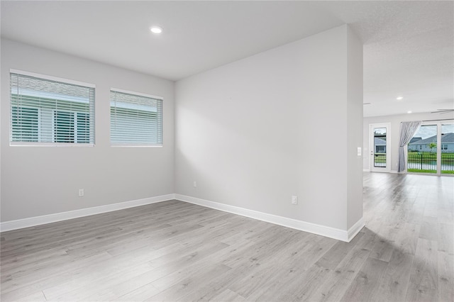 8706 Arrow Creek Dr, Parrish, FL 34219 - spare room featuring light wood-style flooring and recessed lighting