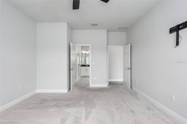 8706 Arrow Creek Dr, Parrish, FL 34219 - unfurnished bedroom featuring carpet floors, ensuite bath, and a ceiling fan