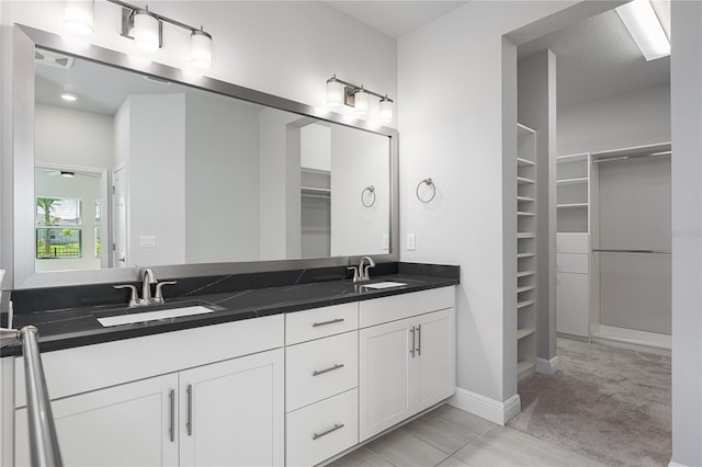 8706 Arrow Creek Dr, Parrish, FL 34219 - full bathroom with a walk in closet and double vanity