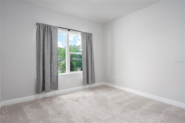 8706 Arrow Creek Dr, Parrish, FL 34219 - carpeted spare room featuring baseboards