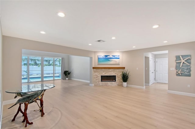 444 S Polk Dr, Sarasota, FL 34236 - living room with a fireplace, recessed lighting, and light wood finished floors