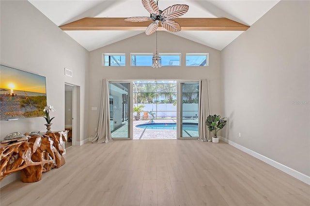 444 S Polk Dr, Sarasota, FL 34236 - empty room featuring ceiling fan, light wood-style flooring, beam ceiling, a sunroom, and high vaulted ceiling