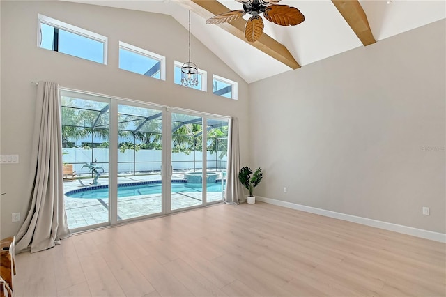 444 S Polk Dr, Sarasota, FL 34236 - spare room featuring ceiling fan, high vaulted ceiling, and light wood finished floors