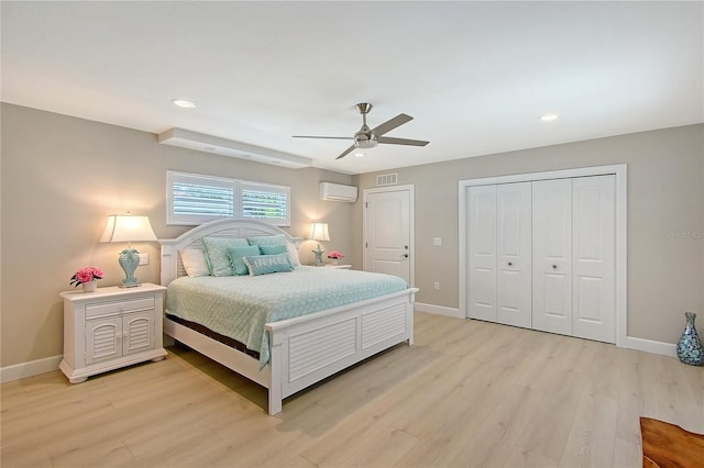 444 S Polk Dr, Sarasota, FL 34236 - bedroom with an AC wall unit, light wood-style floors, recessed lighting, and a ceiling fan