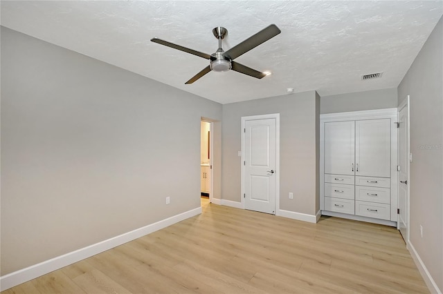 444 S Polk Dr, Sarasota, FL 34236 - unfurnished bedroom featuring light wood-type flooring, a closet, and a ceiling fan
