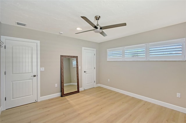 444 S Polk Dr, Sarasota, FL 34236 - unfurnished bedroom with light wood finished floors and a ceiling fan