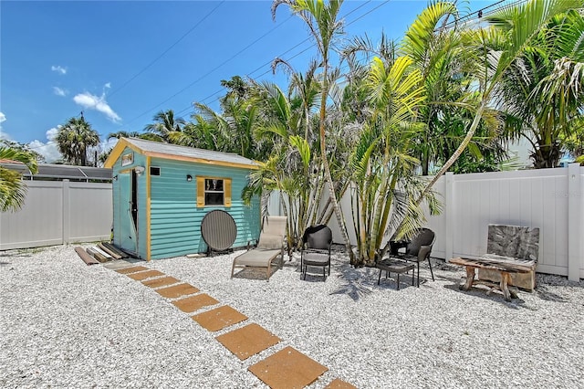 444 S Polk Dr, Sarasota, FL 34236 - fenced backyard with a patio and an outbuilding