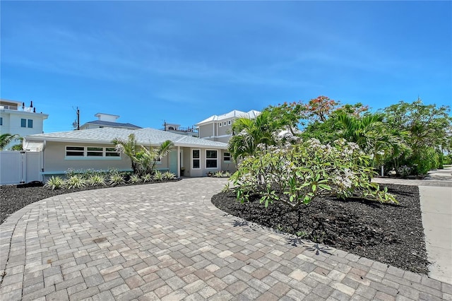 444 S Polk Dr, Sarasota, FL 34236 - view of front facade featuring curved driveway and roof with shingles