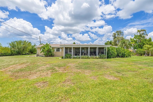 336 Highland Shores Dr, Ellenton, FL 34222 - rear view of property with a sunroom and a lawn