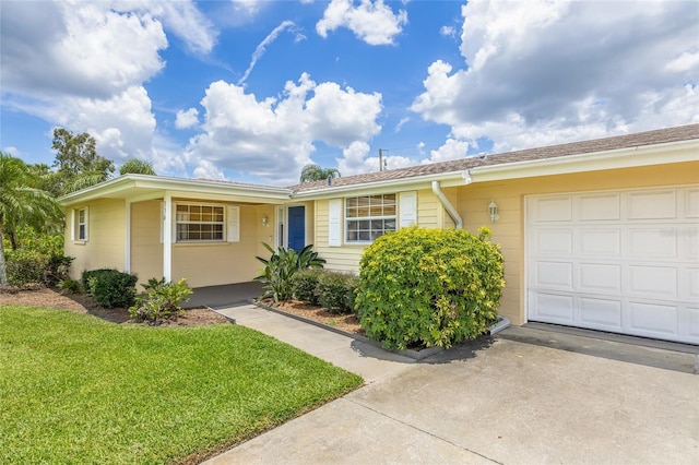 336 Highland Shores Dr, Ellenton, FL 34222 - ranch-style house featuring a front lawn, a garage, and driveway