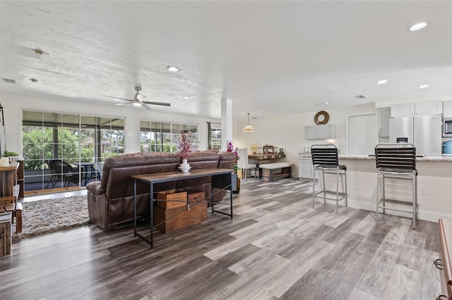 336 Highland Shores Dr, Ellenton, FL 34222 - living area with wood finished floors, ceiling fan, and recessed lighting