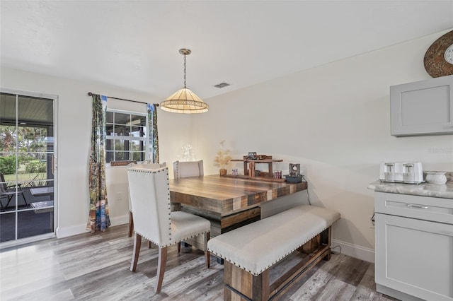 336 Highland Shores Dr, Ellenton, FL 34222 - dining space featuring light wood-style floors and baseboards
