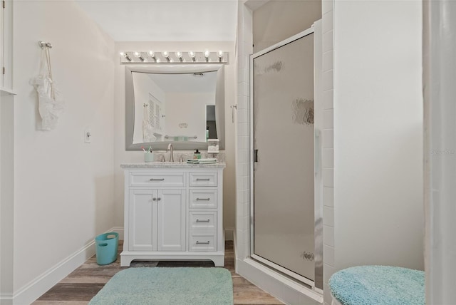 336 Highland Shores Dr, Ellenton, FL 34222 - bathroom with a stall shower, vanity, and wood finished floors