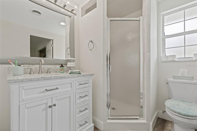 336 Highland Shores Dr, Ellenton, FL 34222 - bathroom featuring a stall shower, vanity, and wood finished floors