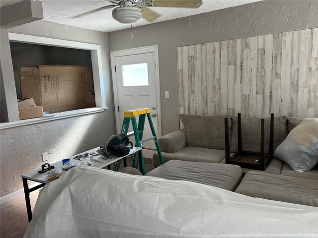 4122 N Lockwood Ridge Rd, Sarasota, FL 34234 - living area featuring a ceiling fan and a textured wall