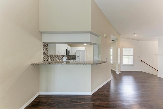 803 Montrose Dr Unit 201, Venice, FL 34293 - kitchen featuring white fridge with ice dispenser, stone countertops, a peninsula, white cabinets, and dark wood finished floors