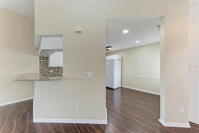 803 Montrose Dr Unit 201, Venice, FL 34293 - spare room featuring dark wood finished floors and recessed lighting
