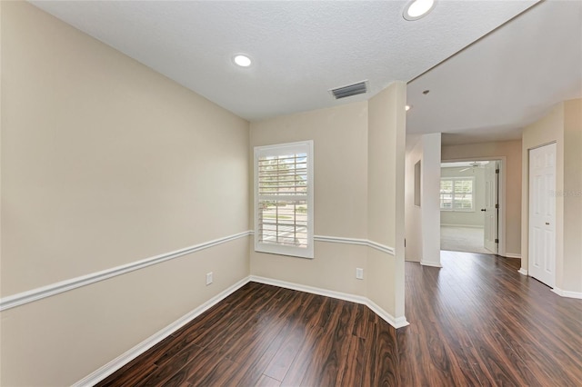 803 Montrose Dr Unit 201, Venice, FL 34293 - spare room with dark wood-type flooring and recessed lighting