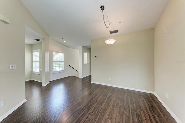 803 Montrose Dr Unit 201, Venice, FL 34293 - empty room with dark wood-style floors and baseboards